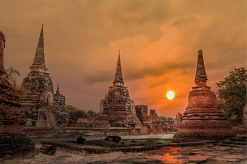Fototapeta premium Double exposure sculpture Landscape of Ancient old pagoda is Famous Landmark old History Buddhist temple,Beautiful Wat Chai Watthanaram temple in ayutthaya Thailand