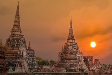 Fototapeta premium Double exposure sculpture Landscape of Ancient old pagoda is Famous Landmark old History Buddhist temple,Beautiful Wat Chai Watthanaram temple in ayutthaya Thailand