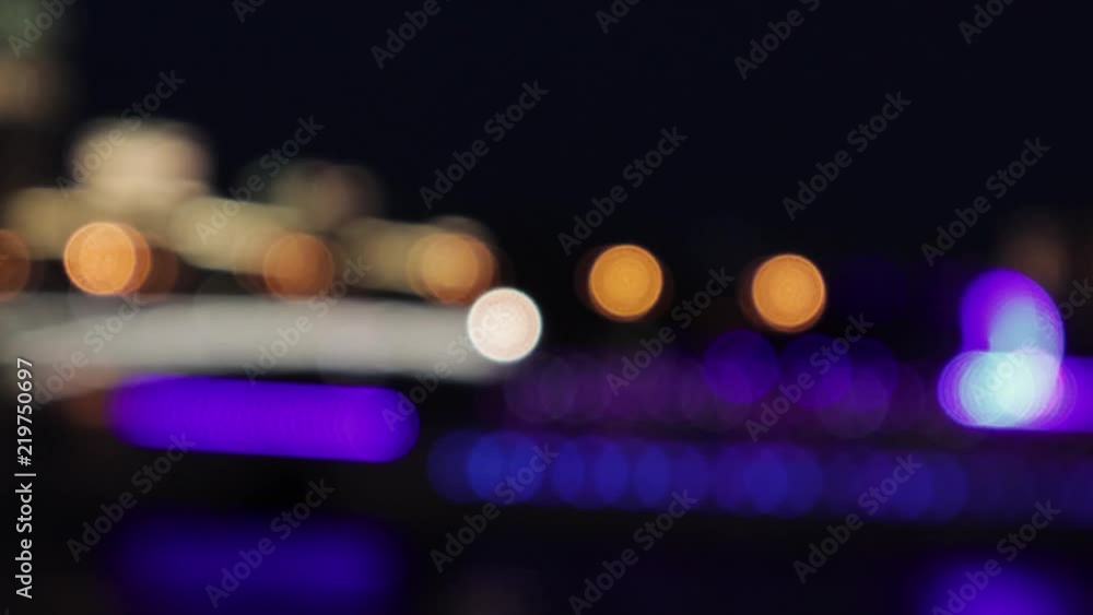 Wall mural 4k video of the colorful bokeh lights. the lights are slowly moving from one side to another.