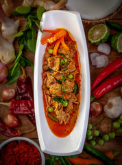 Panang Curry and ingredients on wooden background