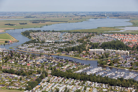Aerial view beach Dutch village Lemmer with lake, canals and marina harbor