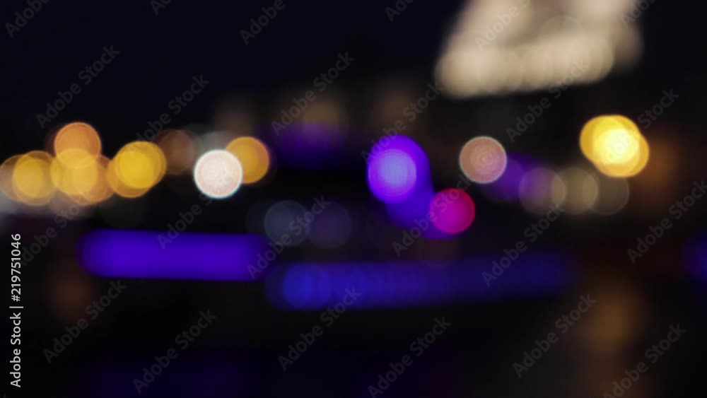 Wall mural 4k video of the colorful bokeh lights. the lights are slowly moving from one side to another.