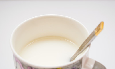 A cup of tea with milk.