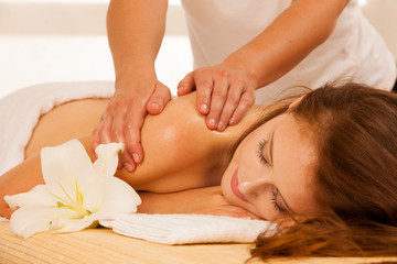 Fototapeta na wymiar Body care. Spa body massage treatment. Woman having massage in the spa salon