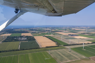 Aerial view Dutch landscape province Flevoland with farmland and wind turbines