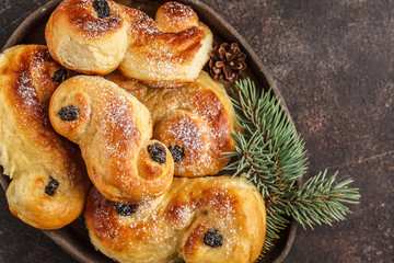 Traditional Swedish Christmas saffron buns (lussebulle or lussekatt). Swedish christmas. © vaaseenaa