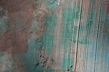 close-up view of old rough grey and green concrete wall texture