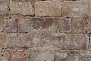close up view of old cracked brick wall textured background