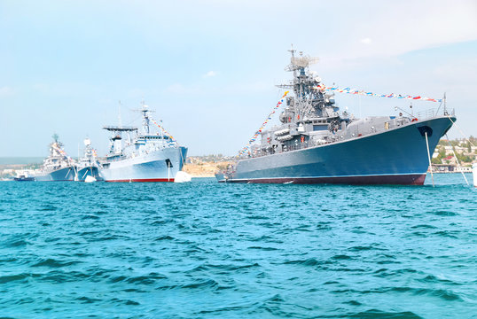 Military Navy Ships In Order On Blue Sea