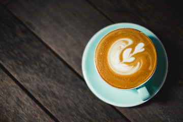 Coffee latte art with heart on top with copy space