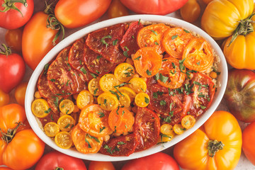 Tomato vegetarian pie with chickpeas and parsley in white dish, top view.
