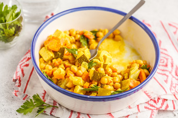 Vegan chickpea vegetables with coconut milk and cilantro.
