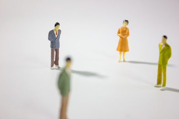 Miniature group of businessman social closeup.