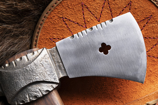 Close up of a tomahawk head in a leather case