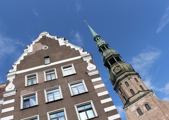 Fototapeta na wymiar The bell tower of St. Peter's Church. Gothic Lutheran Church in Riga, Latvia.