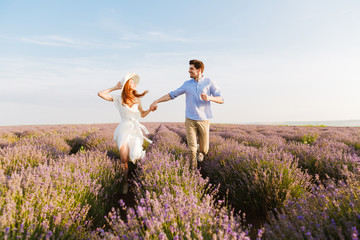 Beautiful young couple embracing at the lavender field