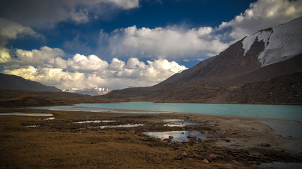 Fototapeta na wymiar Panoramic view to lakes at Barskoon pass, river and gorge and Sarymoynak pass, Jeti-Oguz, Kyrgyzstan