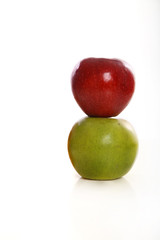 green red apples white studio background
