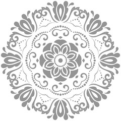Elegant round gray ornament in classic style. Abstract traditional pattern with oriental elements. Classic vintage pattern