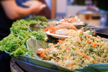 fried rice with vegetables, pork or meat - thai cuisine street food concept