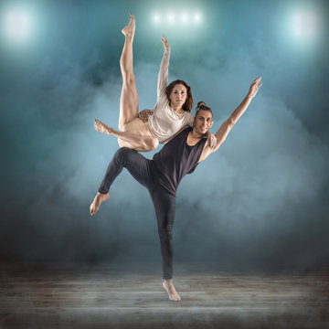 Two person, dancers, woman and man in dynamic action figure pose