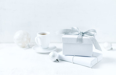 An arrangement of gift boxes and Christmas decorations on white background. Symbolic image. Copy...
