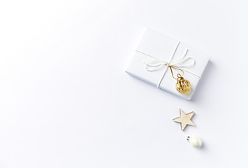 Christmas present with Christmas decorations on white background. Flatlay.  Symbolic image. Copy space