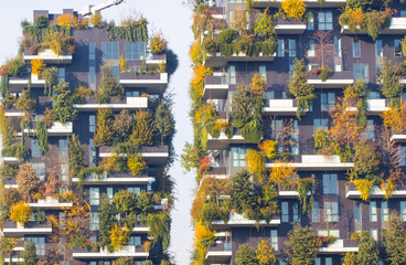 MILAN, ITALY, NOVEMBER 23, 2017 Business District smart city building a part of the economic Zone, modern condo building with trees growing on balconies, Bosco Verticale residential towers.