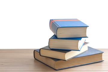 Book stack or pile of book on wooden table in white background with clipping path, back to school concept.