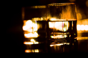 colored lighting of glasses in the night club bar