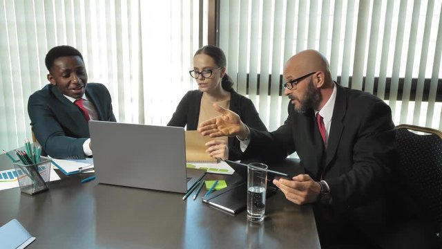 Successful multi-businesspeople discuss new startups in slow motion