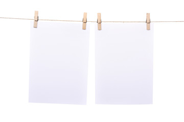 Two paper sheet hanging on rope