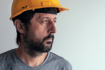 Portrait of serious thoughtful construction engineer