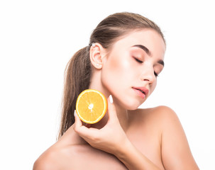 Young woman with citrus fructs in her hands isolated on white background. Skin care, cosmetology...
