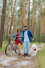 Eco tourism. Young beautiful couple wearing stylish clothes feeling happy while enjoying eco tourism together