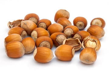 hazelnut heap isolated on white background.
