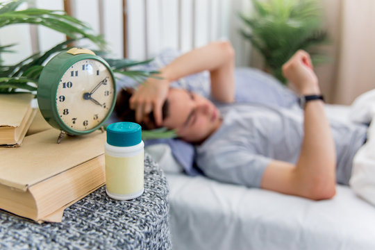 Man waking up late for work, he overslept