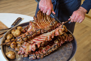 Roasted meat over an open fire, cooked in a special way.Barbecue is prepared of lamb or sheep meat and processed by slasher.