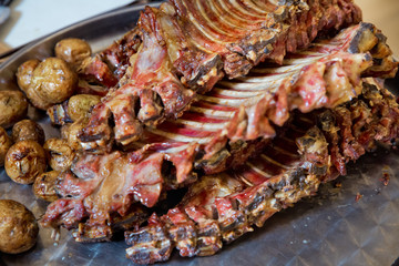 Roasted meat over an open fire, cooked in a special way.Barbecue is prepared of lamb or sheep meat and processed by slasher.
