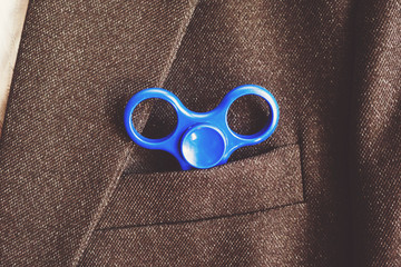 Blue spinner in the pocket of the blazer business businessman