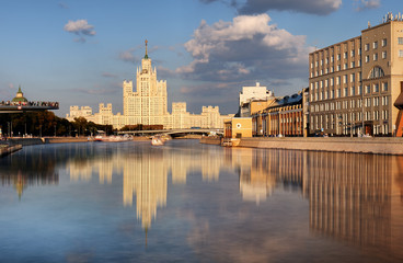 Fototapeta premium Moskvoretskaya embankment and high-rise building on the Kotelnicheskaya embankment and Moskva-river. Winter cityscape. Moscow, Russia