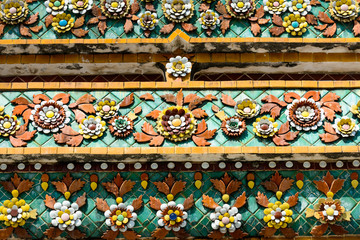Close up beauitful mosaic tiles of large stupas in Wat Pho or Wat Phra Chetuphon Vimolmangklararm Rajwaramahaviharn is one of Bangkok's oldest temples
