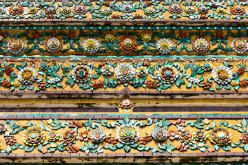 Close up beauitful mosaic tiles of large stupas in Wat Pho or Wat Phra Chetuphon Vimolmangklararm Rajwaramahaviharn is one of Bangkok's oldest temples