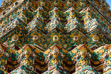 Close up beauitful mosaic tiles of large stupas in Wat Pho or Wat Phra Chetuphon Vimolmangklararm Rajwaramahaviharn is one of Bangkok's oldest temples