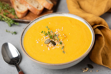 Cream of pumpkin soup. Vegan pumpkin soup in a bowl. Closeup view