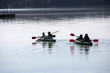 people enjoying kayaking on the river
