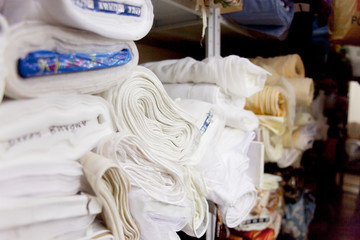 Rolls of fabric and textiles in a shop or store