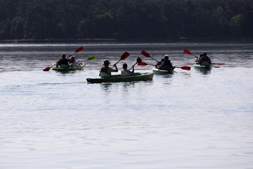 Fototapeta na wymiar people enjoying kayaking on the river 