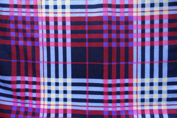 Chequered fabric in blue, violet, red from above