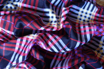 Crumpled multicolored fabric in shades of violet
